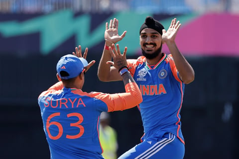 India's Arshdeep Singh, right, celebrates with teammate Suryakumar Yadav after the dismissal of US' Shayan Jahangir during the ICC Men's T20 WC cricket match between United States and India at the Nassau County International Cricket Stadium in Westbury, New York, Wednesday, June 12, 2024.