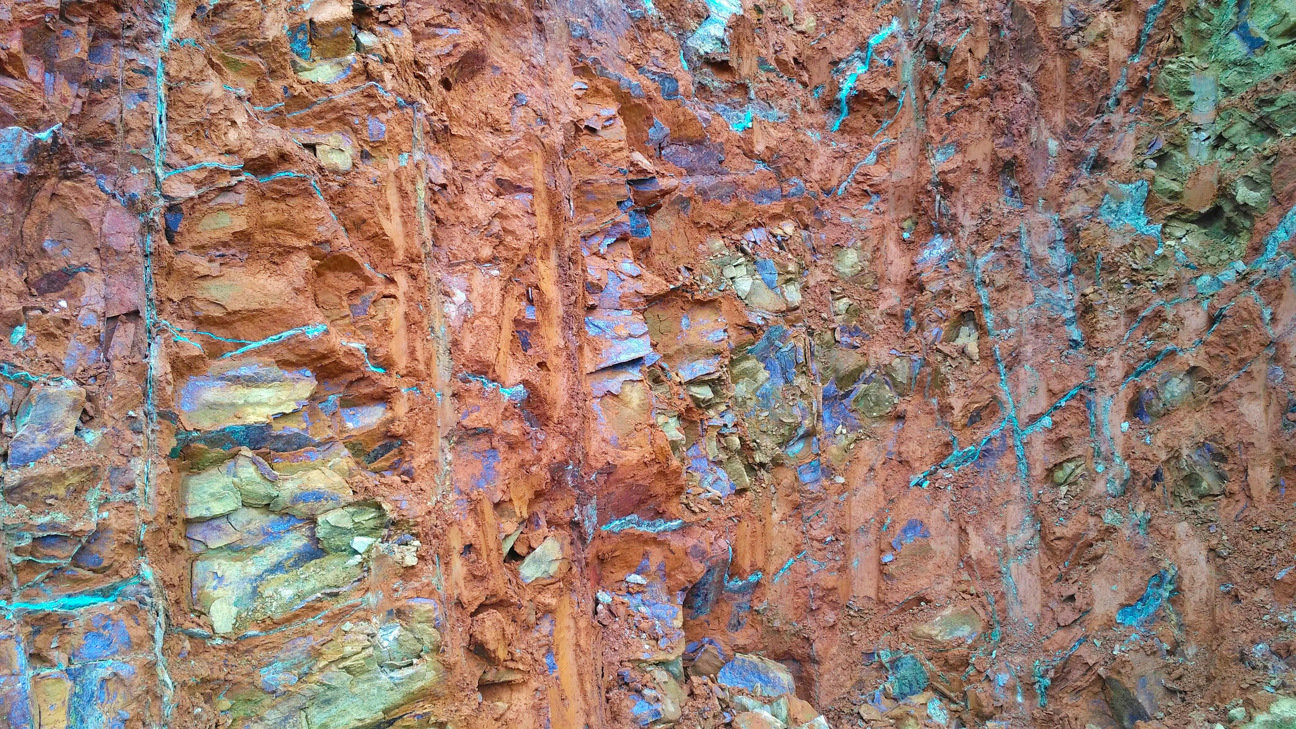 the photo depicts a not focused on the surface of nickel ore saprolite in open pit mines
