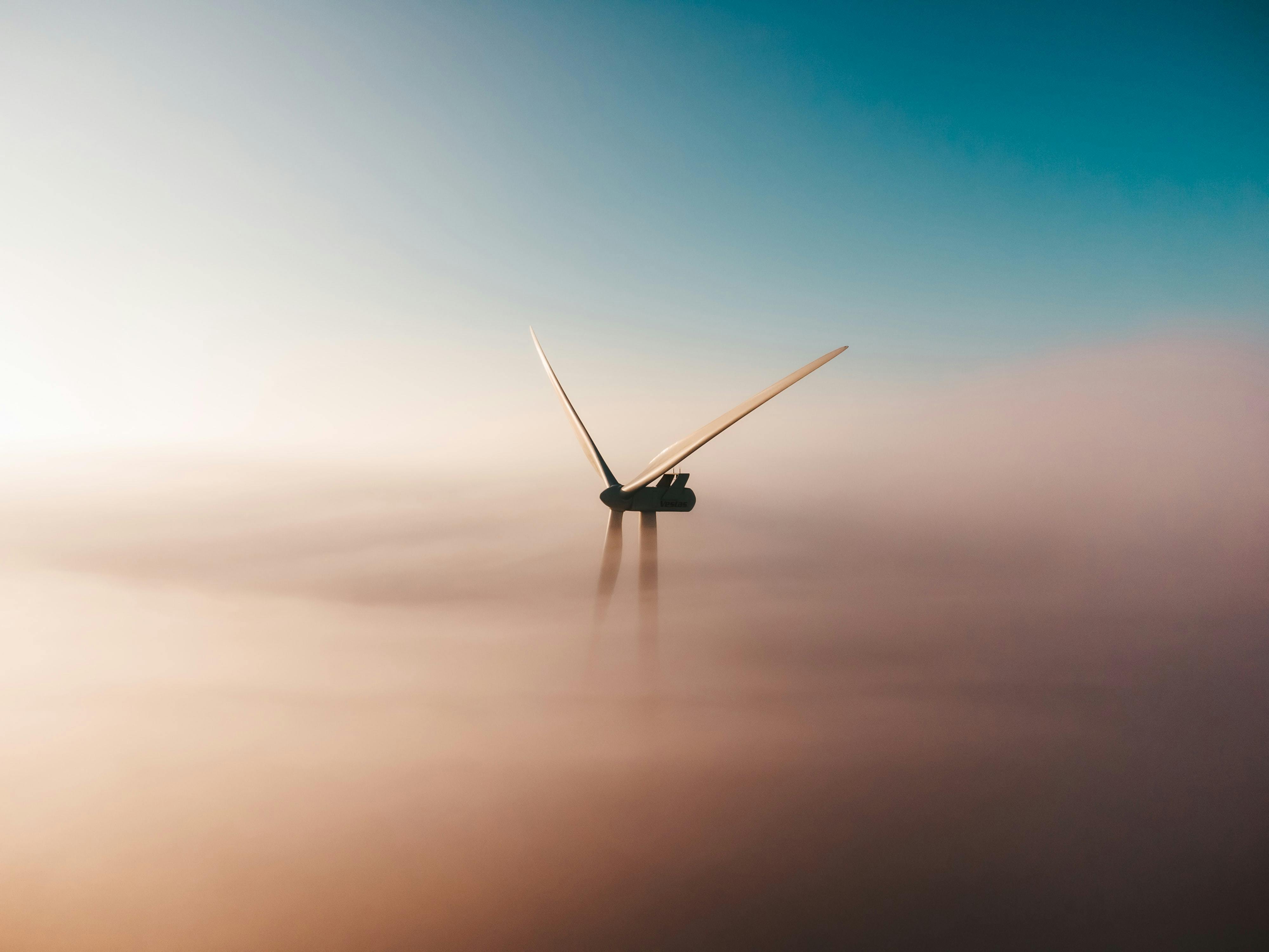 Cover Image Of Renewables 2022 A Photo Of A Wind Turbine Through Soft Hazy Clouds