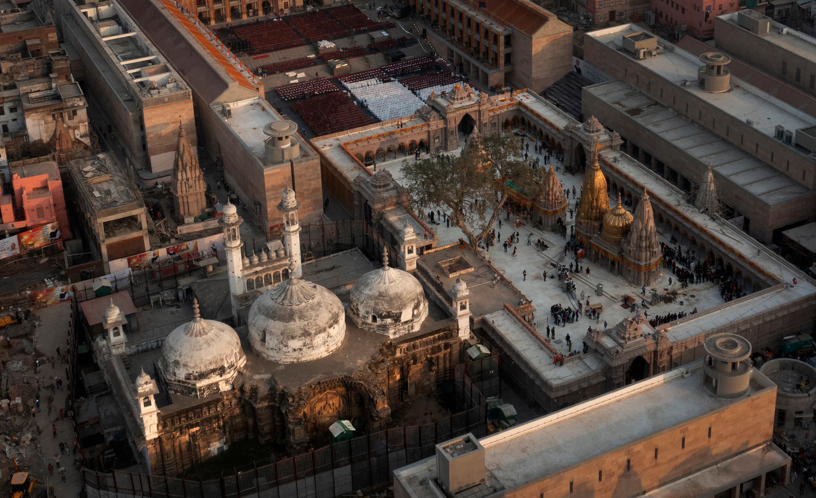 <p>An aerial view shows Gyanvapi mosque, left, and Kashiviswanath temple on the banks of the river Ganges in Varanasi</p>