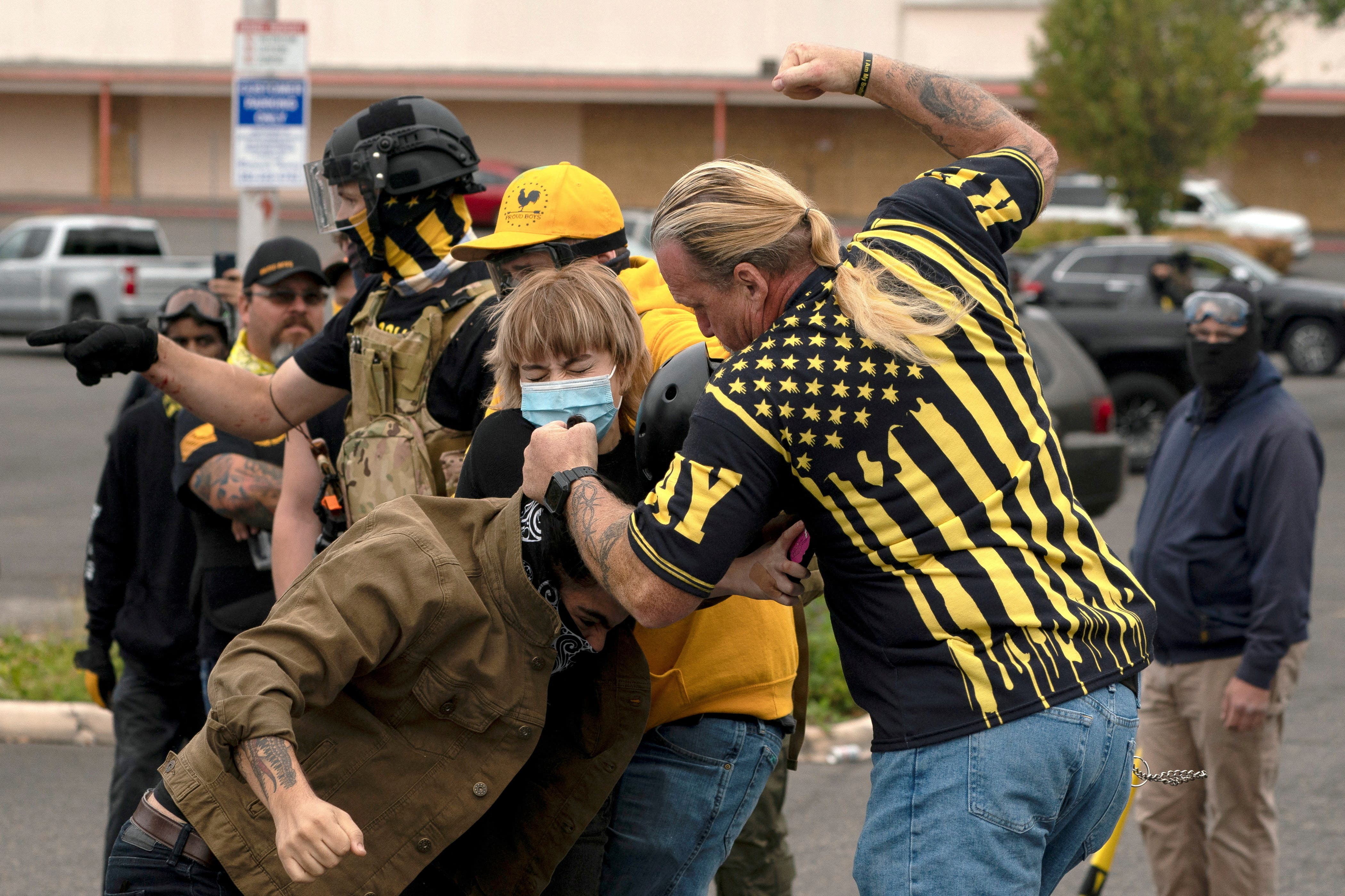 <p>Members of the far-right Proud Boys clash with counter-protesters during rival rallies in Portland, Oregon, U.S., August 22, 2021</p>