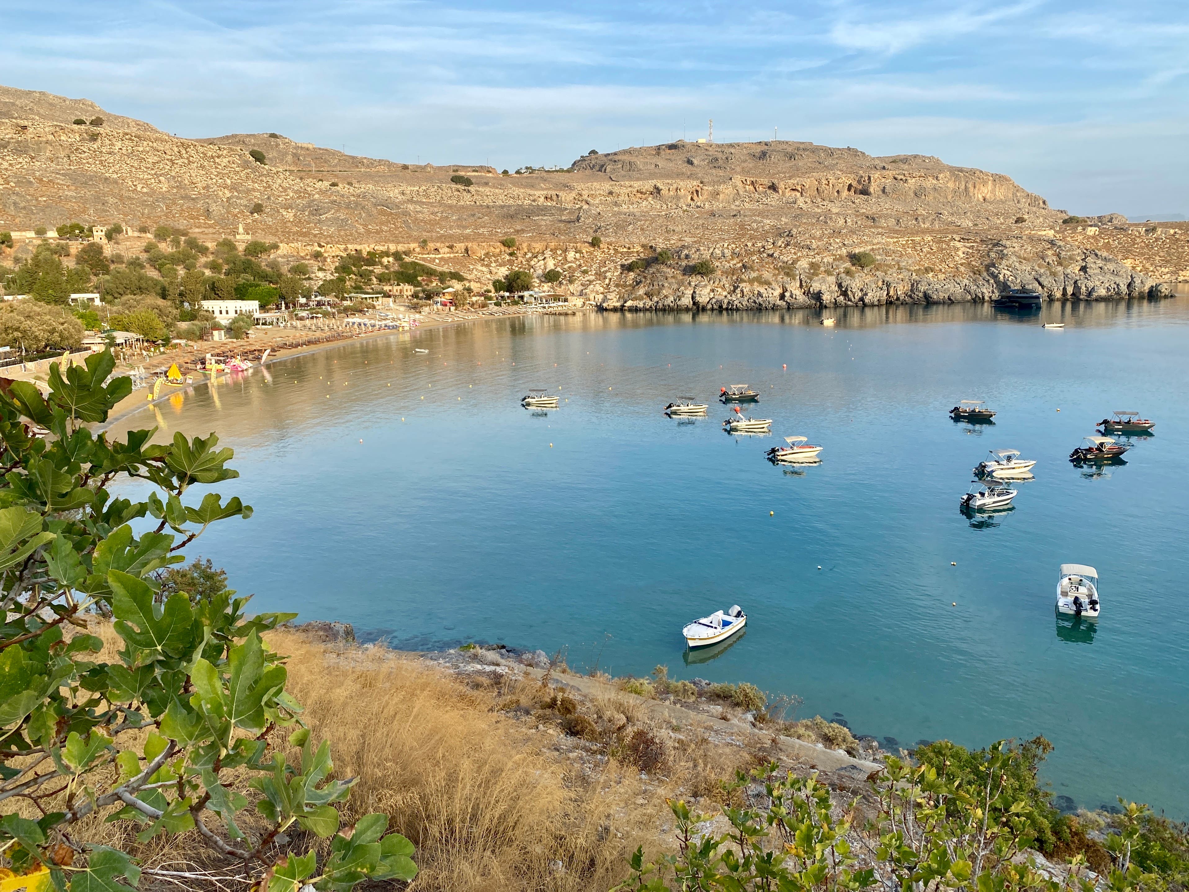 <p>Business as usual: the bay at Lindos in eastern Crete, close to the wildfires of July 2023</p>
