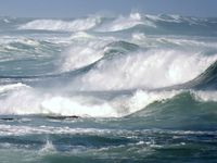 Large ocean waves breaking on a stormy day. (wave; sea; whitecaps; storm)