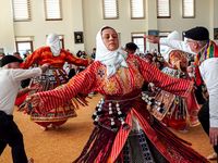 Anatolian Alevi Muslims perform Semah at a Djemevi (cem house or cemevi) to celebrate Newroz -the arrival of spring - the "Rite of Unity". They pray together in this special mass officiated by religious Alevi leader "Dede", performed dhikr and performed Semah - a religious dance, in Ismir, Turkey, March 26, 2022