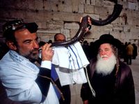 A Jewish man blowing the shofar at the Western Wall (Jerusalem, Israel)during Rosh Hashanah Jewish Holiday on September 18, 2009. (holidays, Judaism, new year)