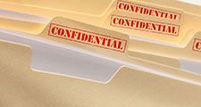 Manila folders marked confidential.