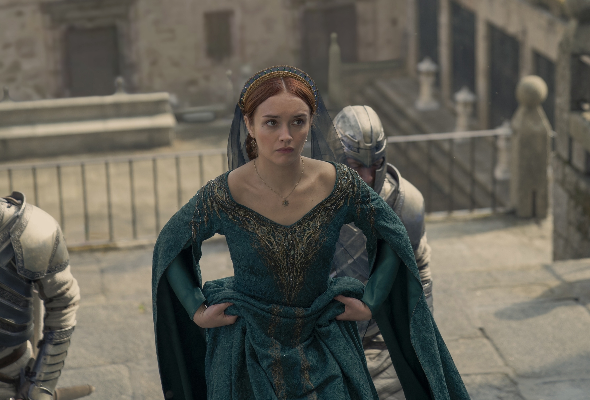 A red-haired woman in a green medieval dress; still from 'House of the Dragon'