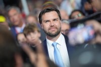 A photo of Senator J.D. Vance smiling in the middle of a crowd.