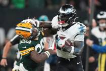 Philadelphia Eagles wide receiver A.J. Brown (11) push off Green Bay Packers safety Xavier McKi ...