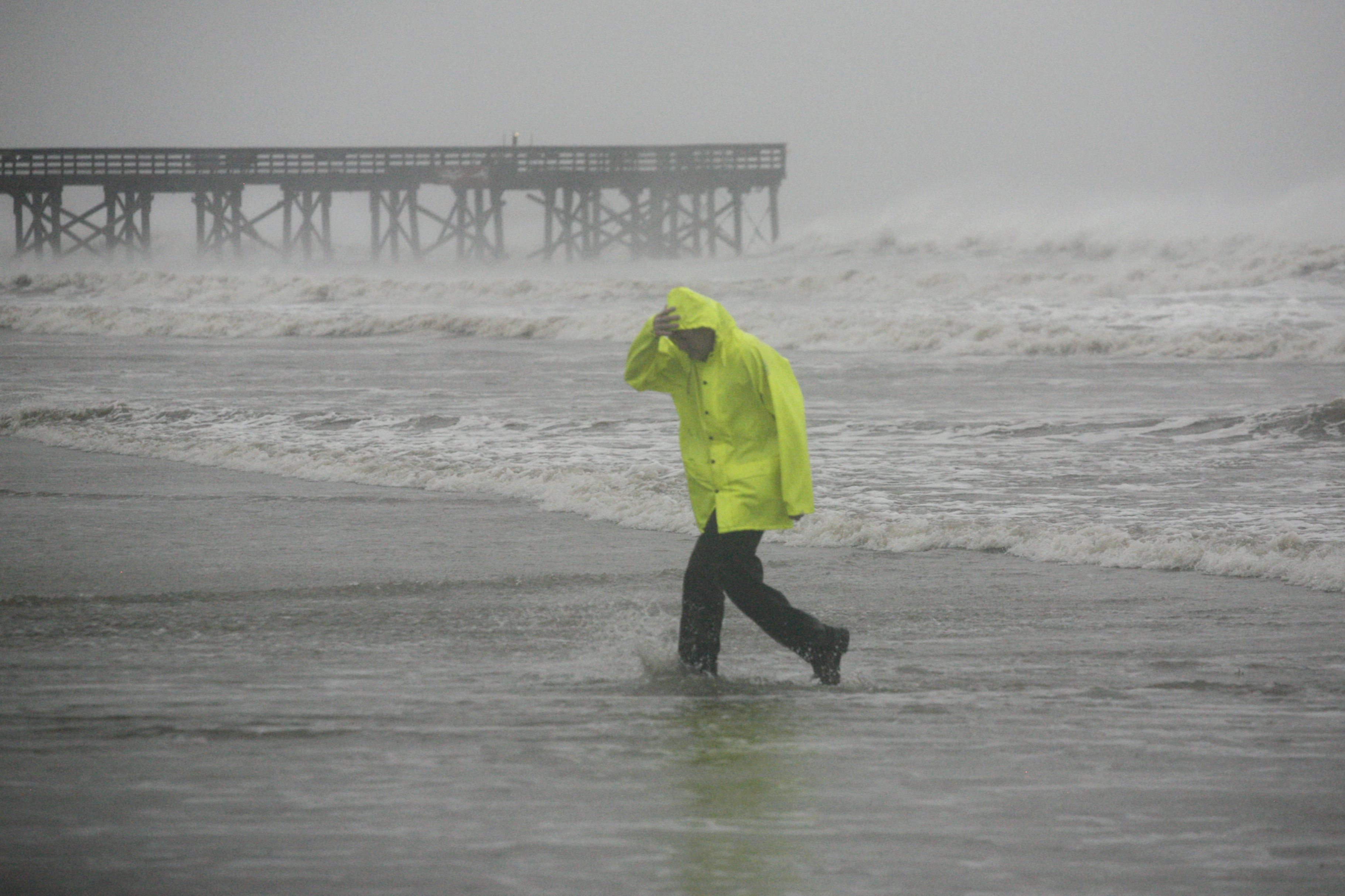 David Reedy braves the wind and rain on the Isle of Palms beach as Hurricane Matthew hits the Isle of Palms, S.C. on Oct. 8.