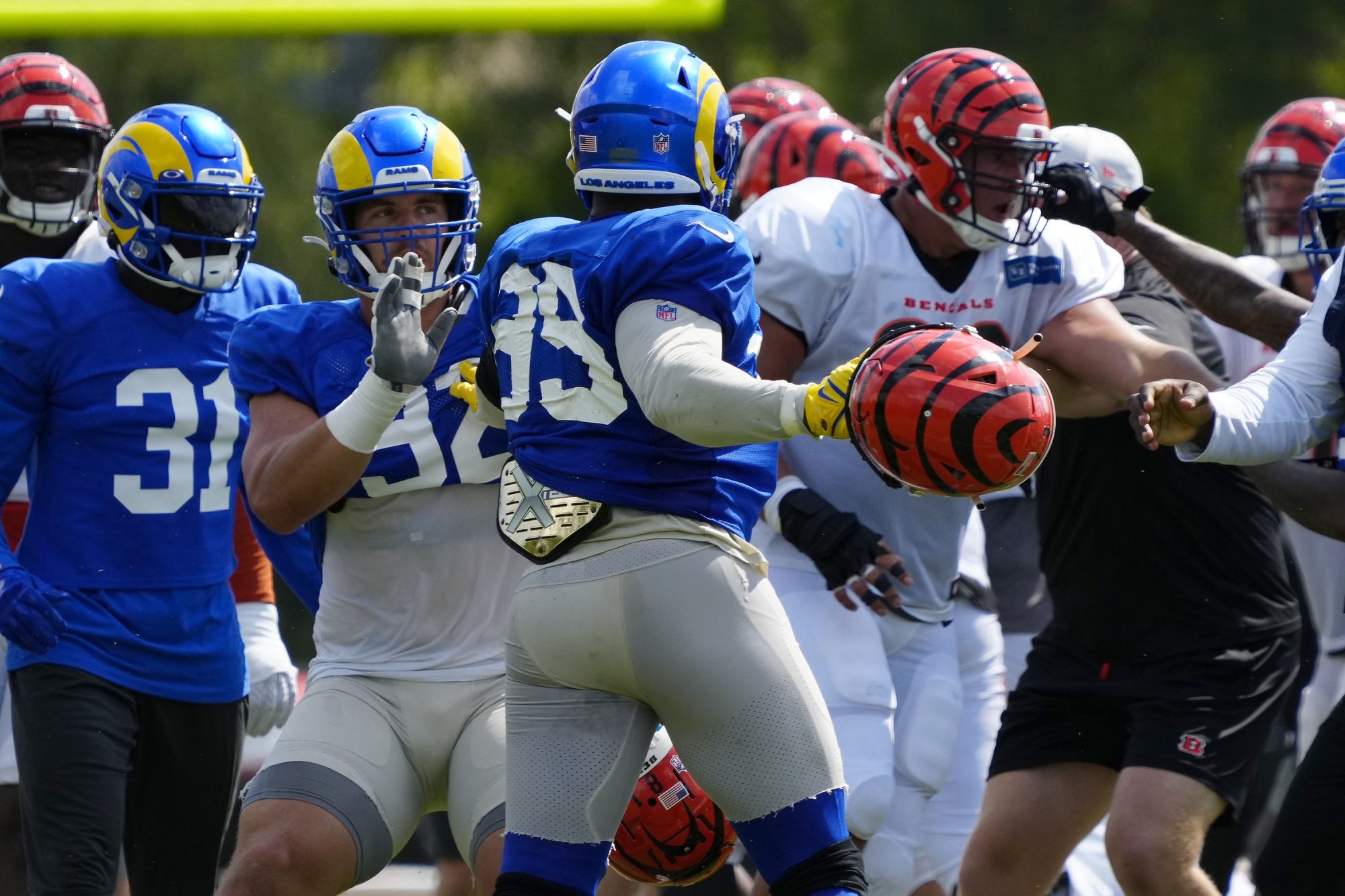 Aaron Donald seen holding a Bengals helmet in a brawl between Cincinnati and the Rams during a joint preseason practice in Cincinnati, on Thursday, Aug. 25, 2022.