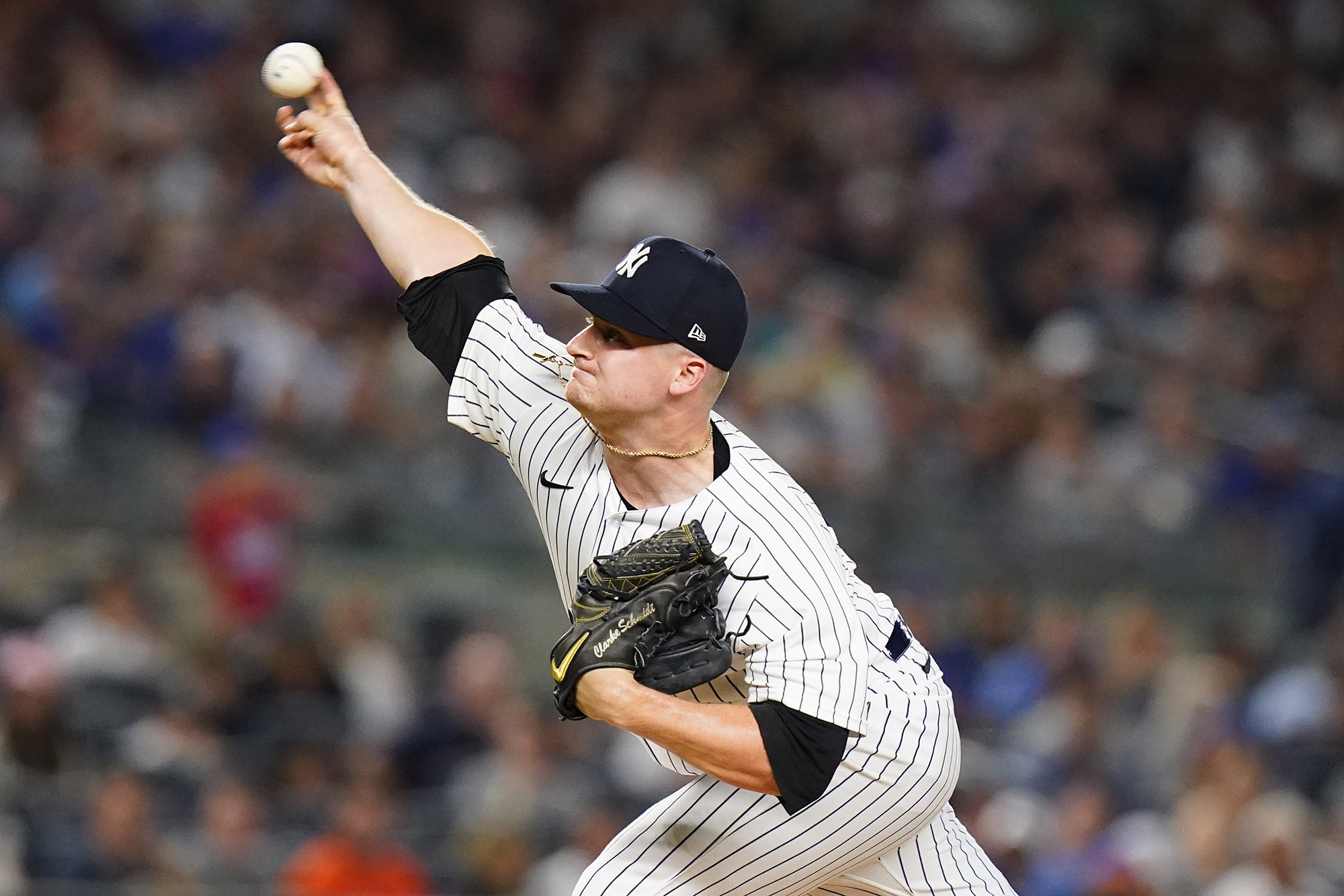 Clarke Schmidt of the New York Yankees pitches during the sixth inning of a baseball game against the New York Mets.