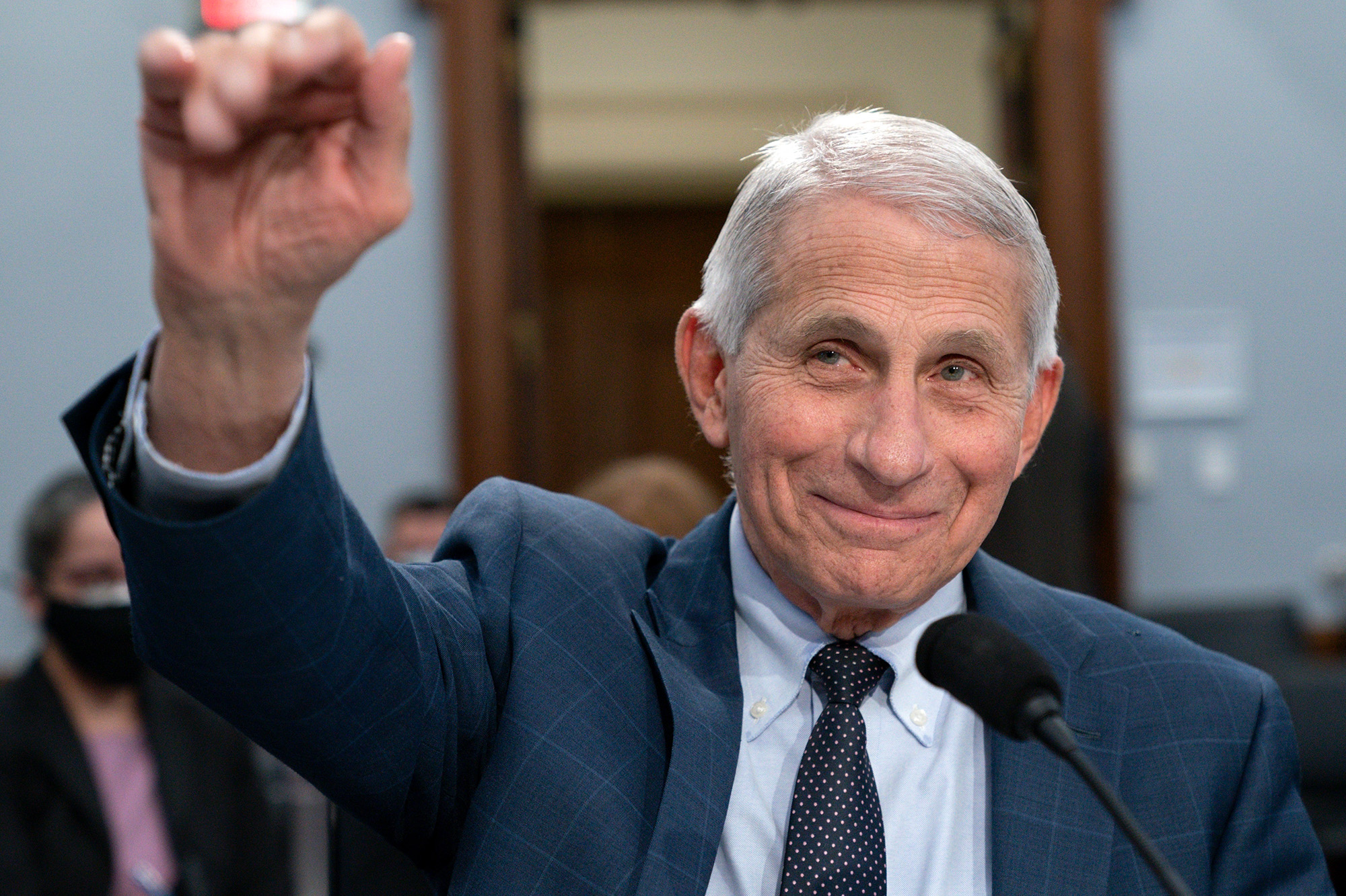 Dr. Anthony Fauci, Director of the National Institute of Allergy and Infectious Diseases, waves hello to the committee at the start of a House Committee on Appropriations subcommittee on Labor, Health and Human Services, Education, and Related Agencies hearing, about the budget request for the National Institutes of Health, May 11, 2022, on Capitol Hill in Washington.