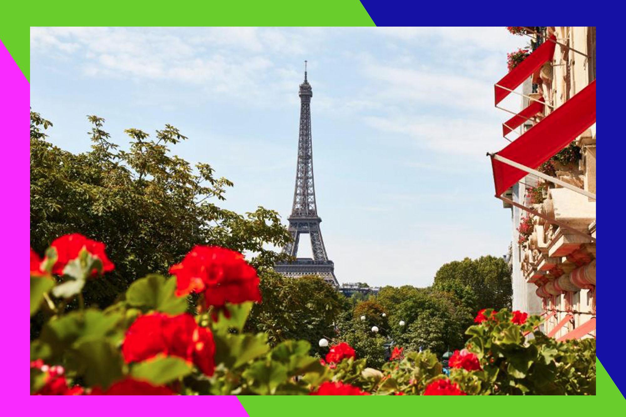 A tower in Paris surrounded by red flowers and trees