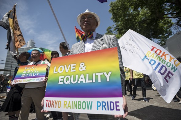 Participants march in the Tokyo Rainbow Pride parade on the streets of Tokyo, Japan on 6 May 2018