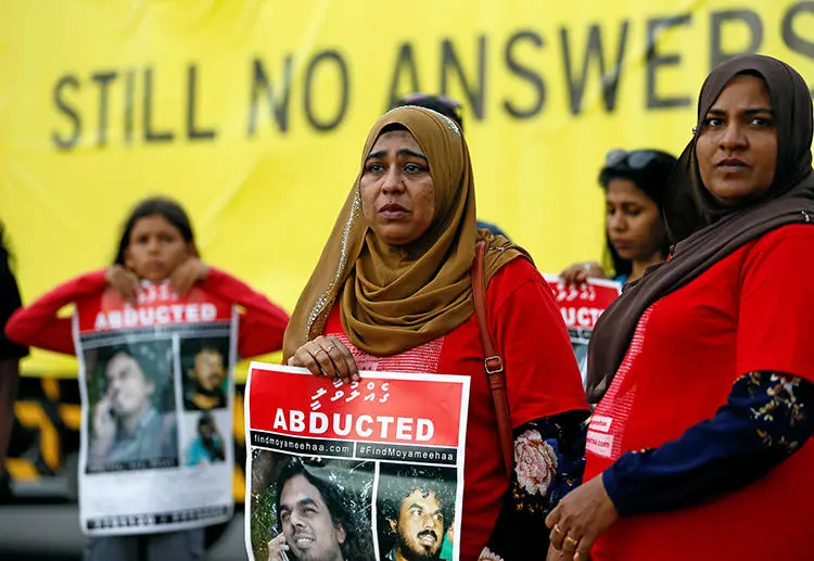 Family members of Maldivian journalist Ahmed Rilwan Abdulla are seen in Colombo, Sri Lanka, on August 28, 2018. A presidential commission in the Maldives recently announced that the journalist was killed in 2014. (Reuters/Dinuka Liyanawatte)