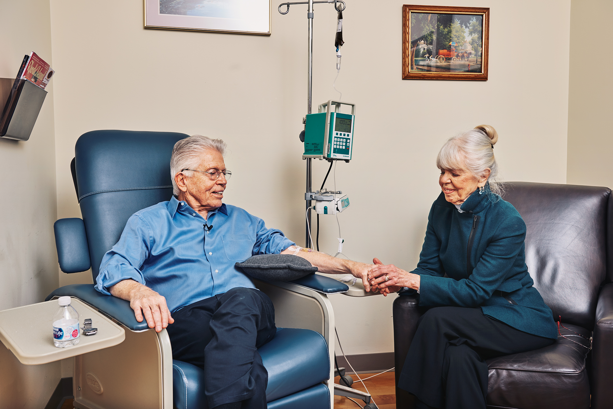 Peter Wooding, with his his wife JoAnn, receiving an infusion of the experimental Alzheimer's drug aducanumab in 2017.