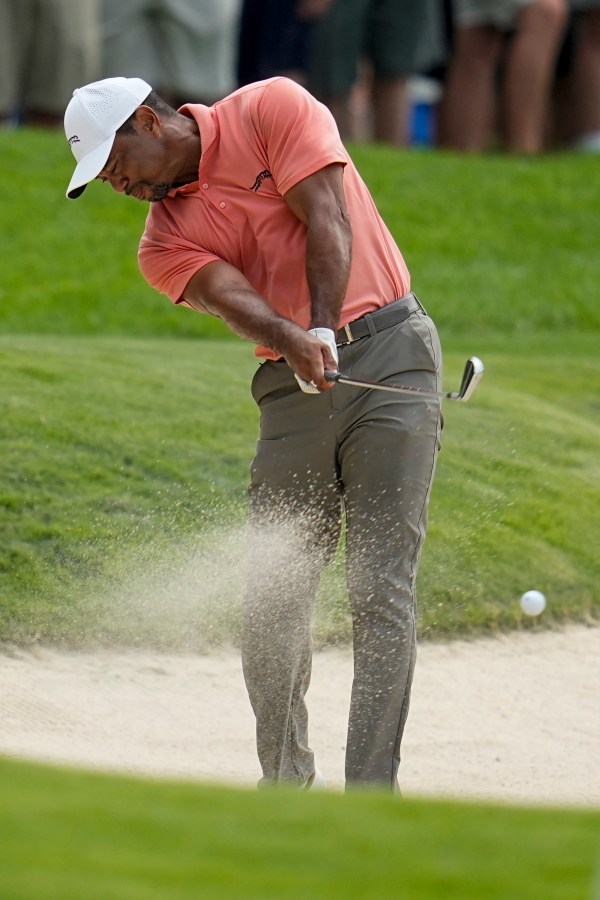 Tiger Woods hits from the bunker on the second hole during the first round of the PGA Championship golf tournament at the Valhalla Golf Club, Thursday, May 16, 2024, in Louisville, Ky. (AP Photo/Sue Ogrocki)