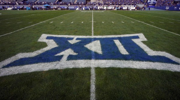 FILE - The logo for the Big 12 Conference has been applied to the field for an NCAA college football game between Sam Houston State and BYU, Sept. 2, 2023, in Provo, Utah. Big 12 schools will share in a record $470 million in revenue distribution, which the conference announced Friday, May 31, 2024, when wrapping up its first spring meetings as a 14-team league and before growing by two more teams. (AP Photo/Rick Bowmer, File)
