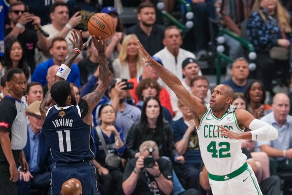 Dallas Mavericks guard Kyrie Irving shoots against Boston Celtics center Al Horford during the first half in Game 3 of the NBA basketball finals, Wednesday, June 12, 2024, in Dallas. (AP Photo/Sam Hodde)