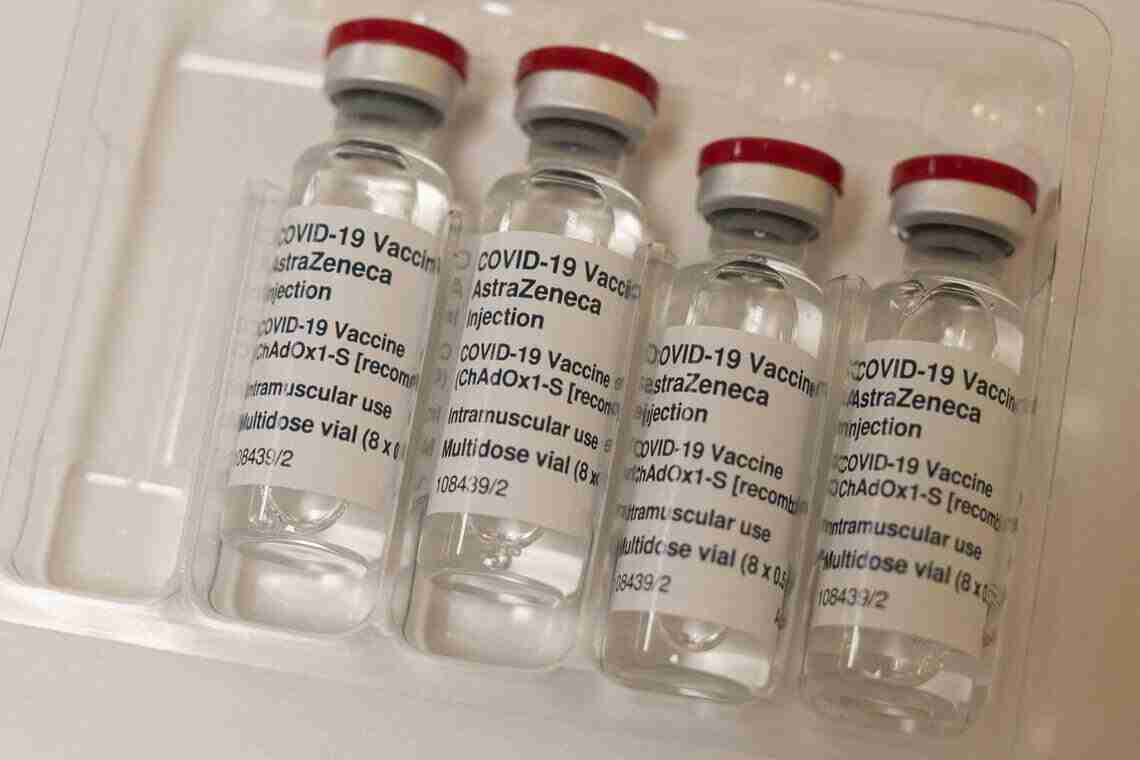 (FILES) Vials of the AstraZeneca/Oxford Covid-19 vaccine, also called Vaxzervria, destined for housebound patients, are pictured at Stubley Medical Centre near Chesterfield, central England on April 14, 2021. British drugmaker AstraZeneca said on May 8, 2024 that it has withdrawn its Covid vaccine Vaxzervria, one of the first produced in the pandemic, citing "commercial reasons" and a surplus of updated jabs. "As multiple, variant Covid-19 vaccines have since been developed there is a surplus of available updated vaccines. This has led to a decline in demand for Vaxzervria, which is no longer being manufactured or supplied," an AstraZeneca spokeperson said. (Photo by OLI SCARFF / AFP)