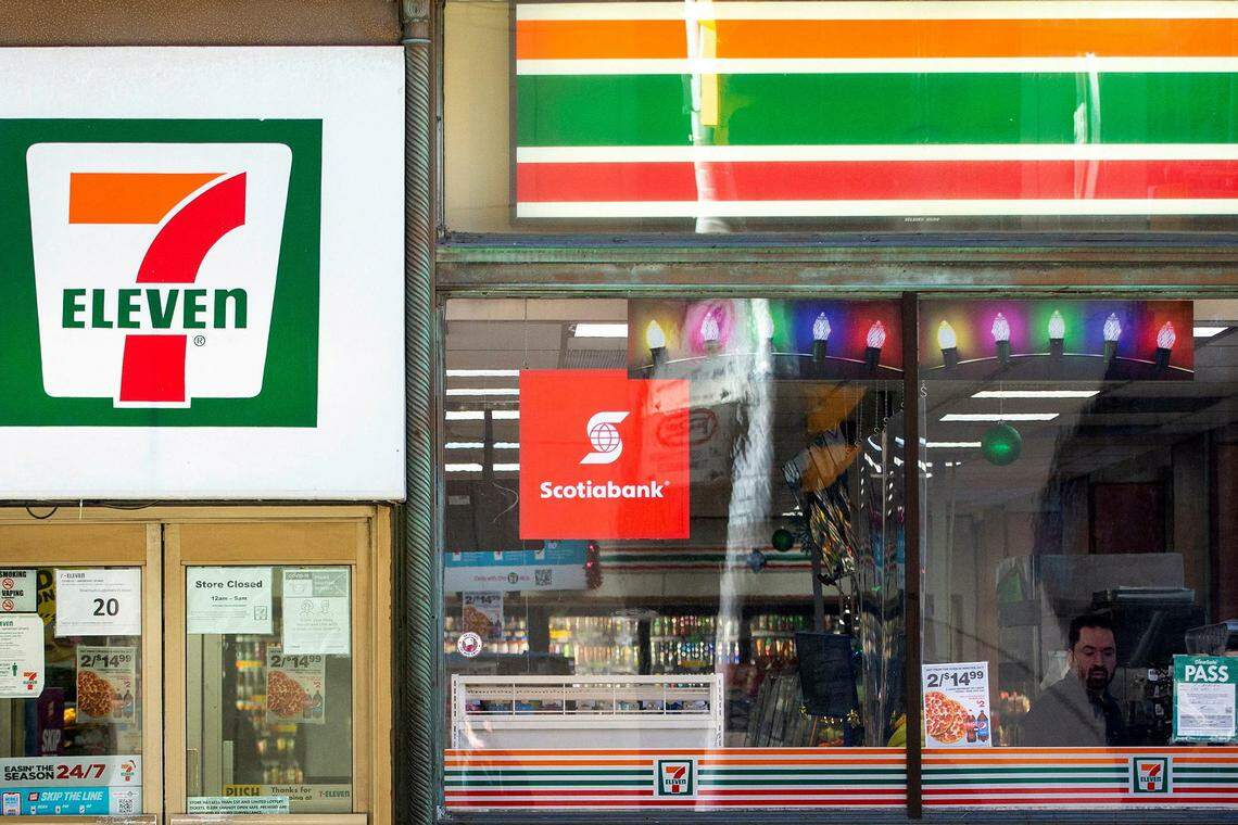 FILE PHOTO: A 7-Eleven storefront in Toronto, Ontario, Canada December 13, 2021.  REUTERS/Carlos Osorio/File Photo