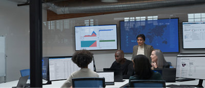 A group of people sitting around a table in a conference room.