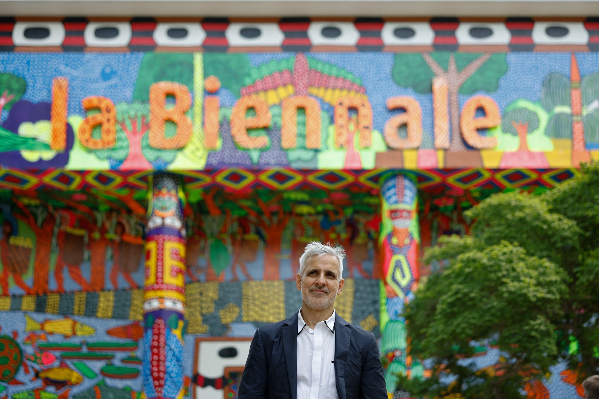 Adriano Pedrosa, artistic director of the 60th edition of the Venice Biennale, in front of the exhibition’s central pavilion, which was intervened by Amazonian collective MAKHU.