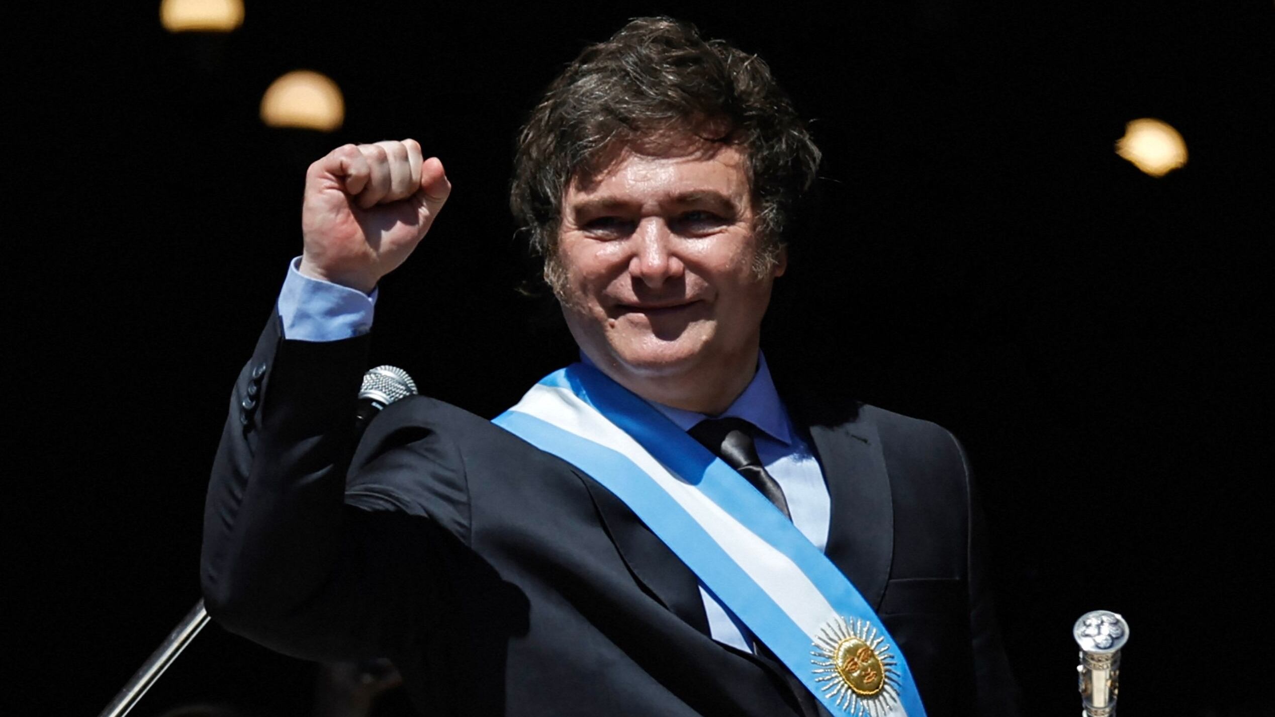 The president of Argentina, Javier Milei, greets supporters from the Casa Rosada.