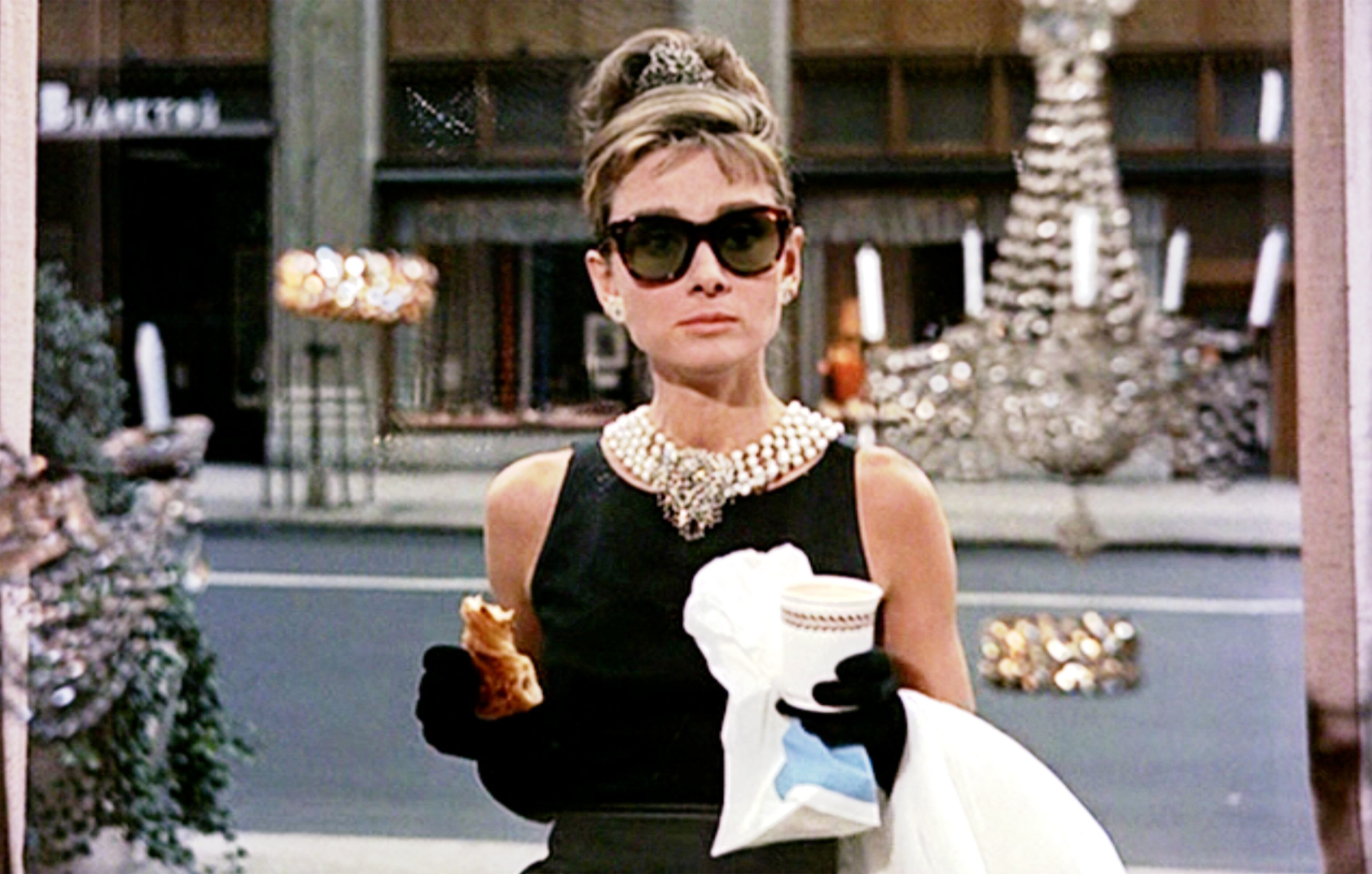 Audrey Hepburn, in front of Tiffany's jewelry store in the opening sequence of 'Breakfast at Tiffany's'.