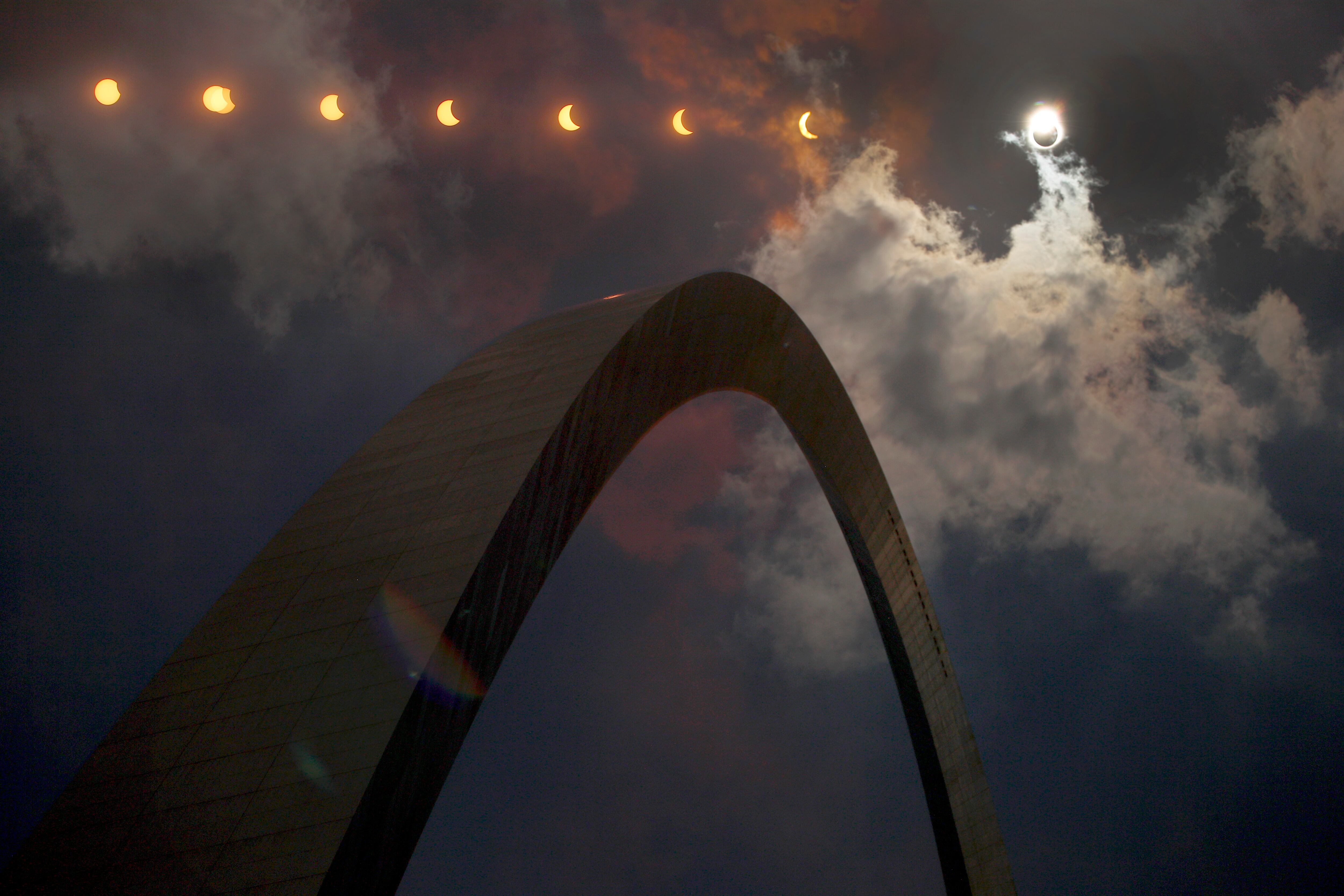 A multiple exposure photograph shows the progression of a solar eclipse over St. Louis on August, 2017.