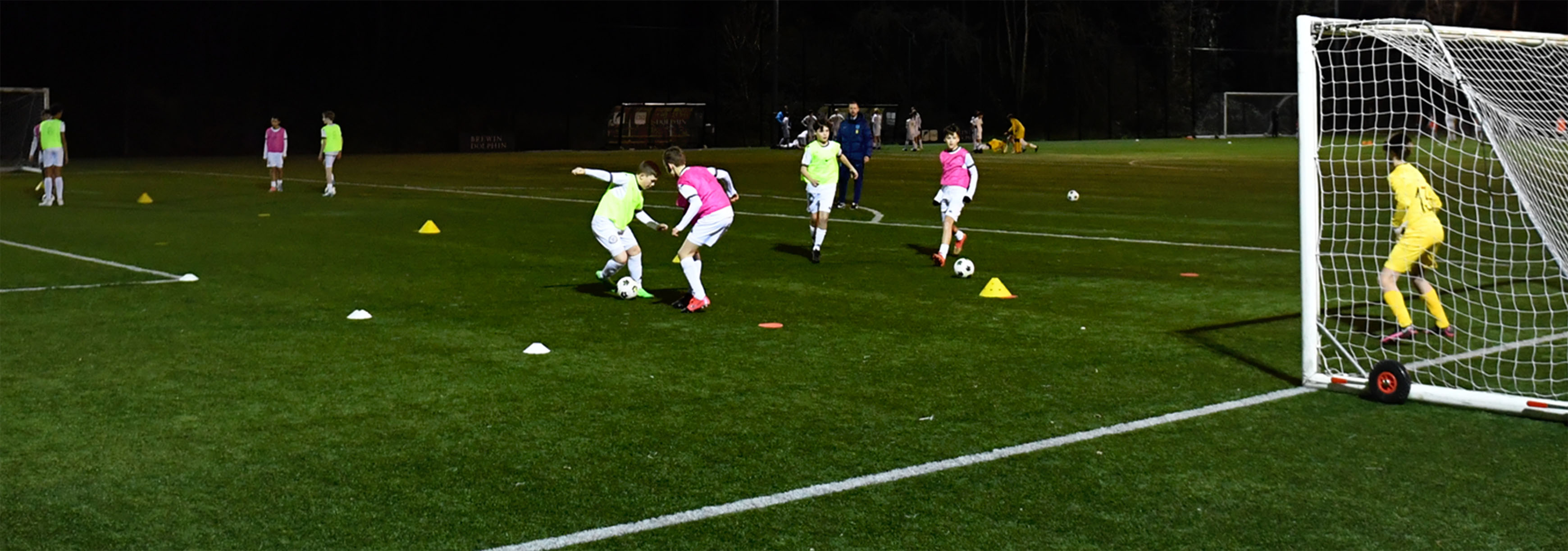 A training session taking place outdoors at night.