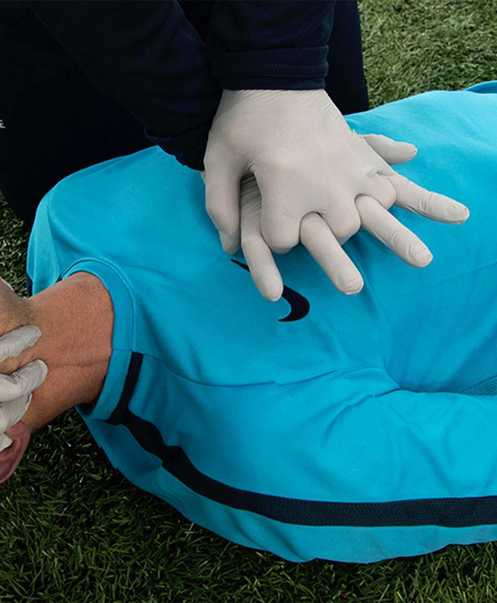 First aiders respond to a player experiencing sudden cardiac arrest