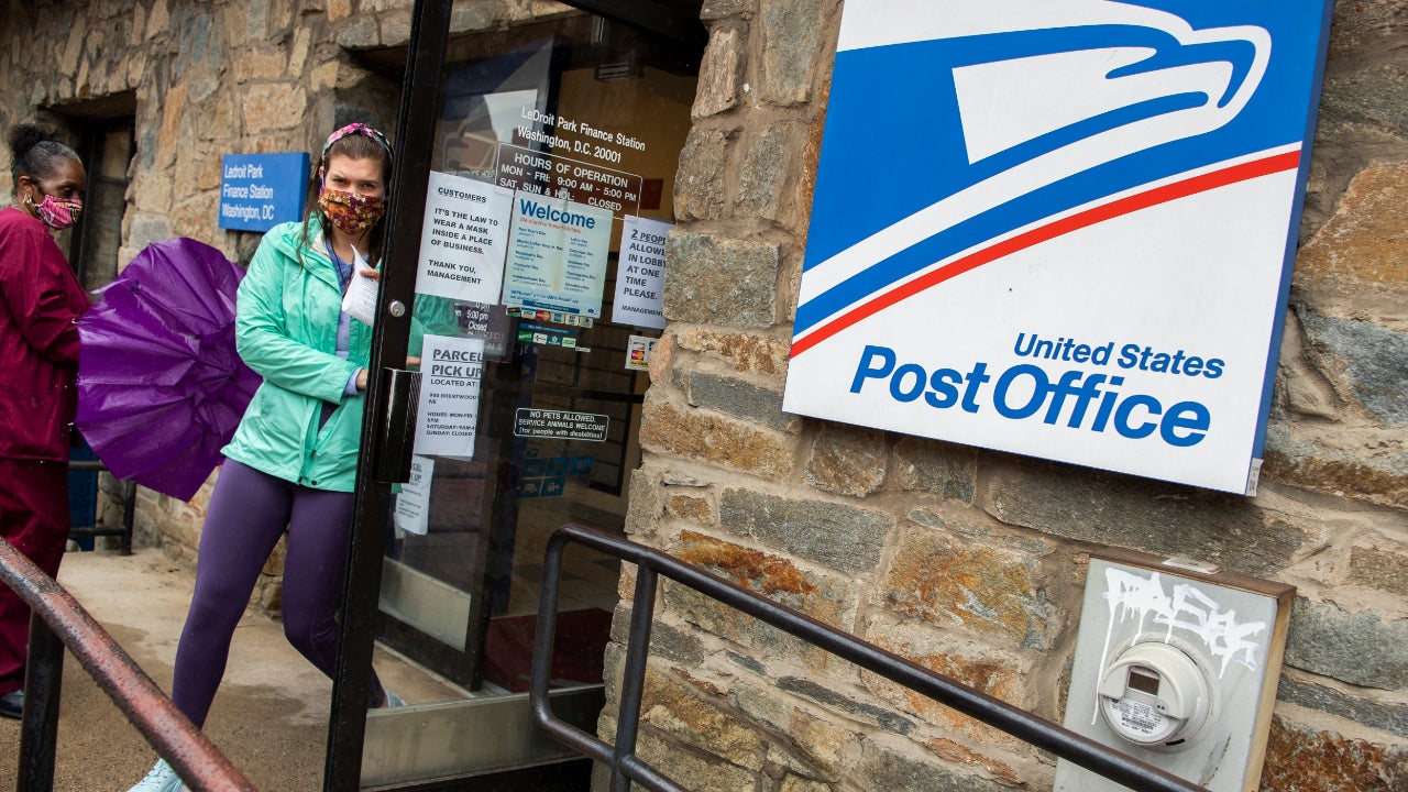 Customers near the door at a USPS location