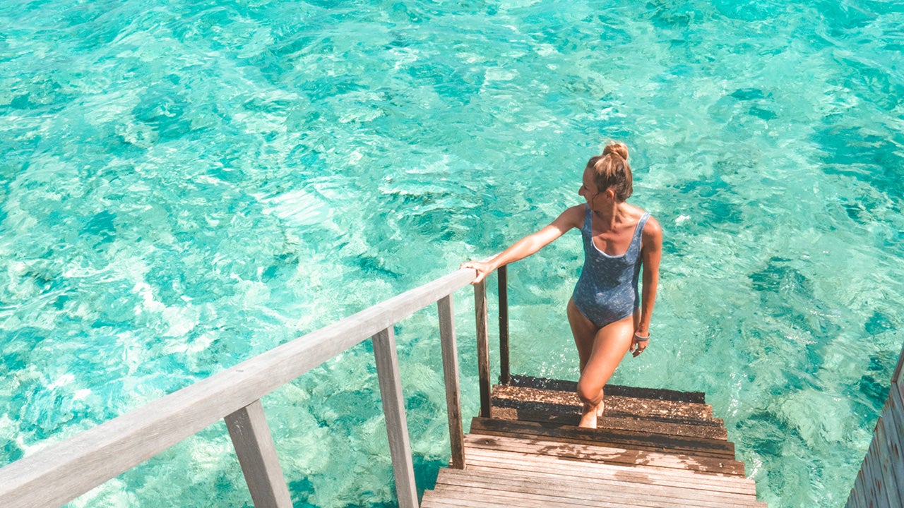 Young woman relaxing in luxury hotel in the Maldives