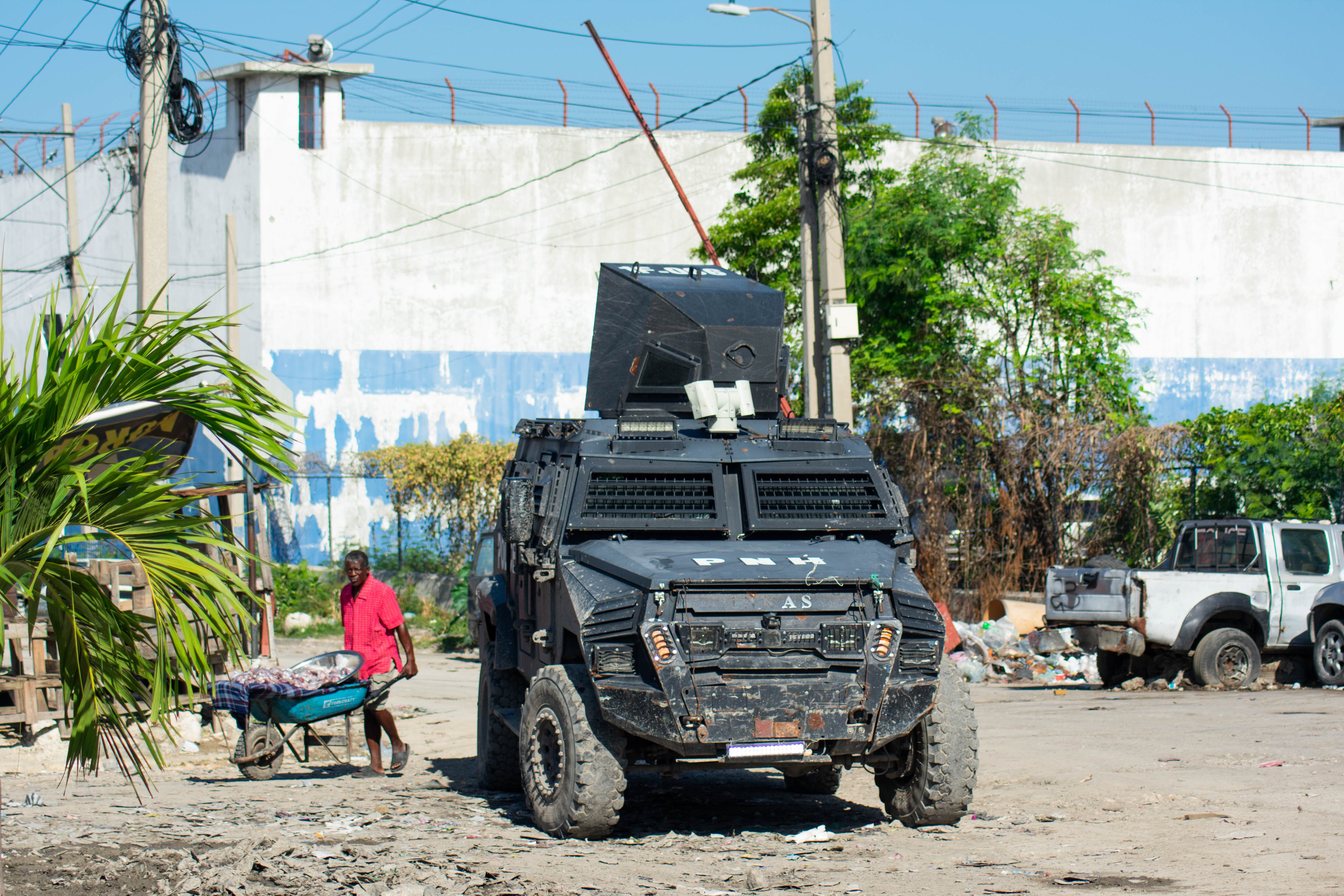 A man walks past the National Penitentiary after an attack by armed gangs in Port-au-Prince, Haiti, on March 3, 2024.