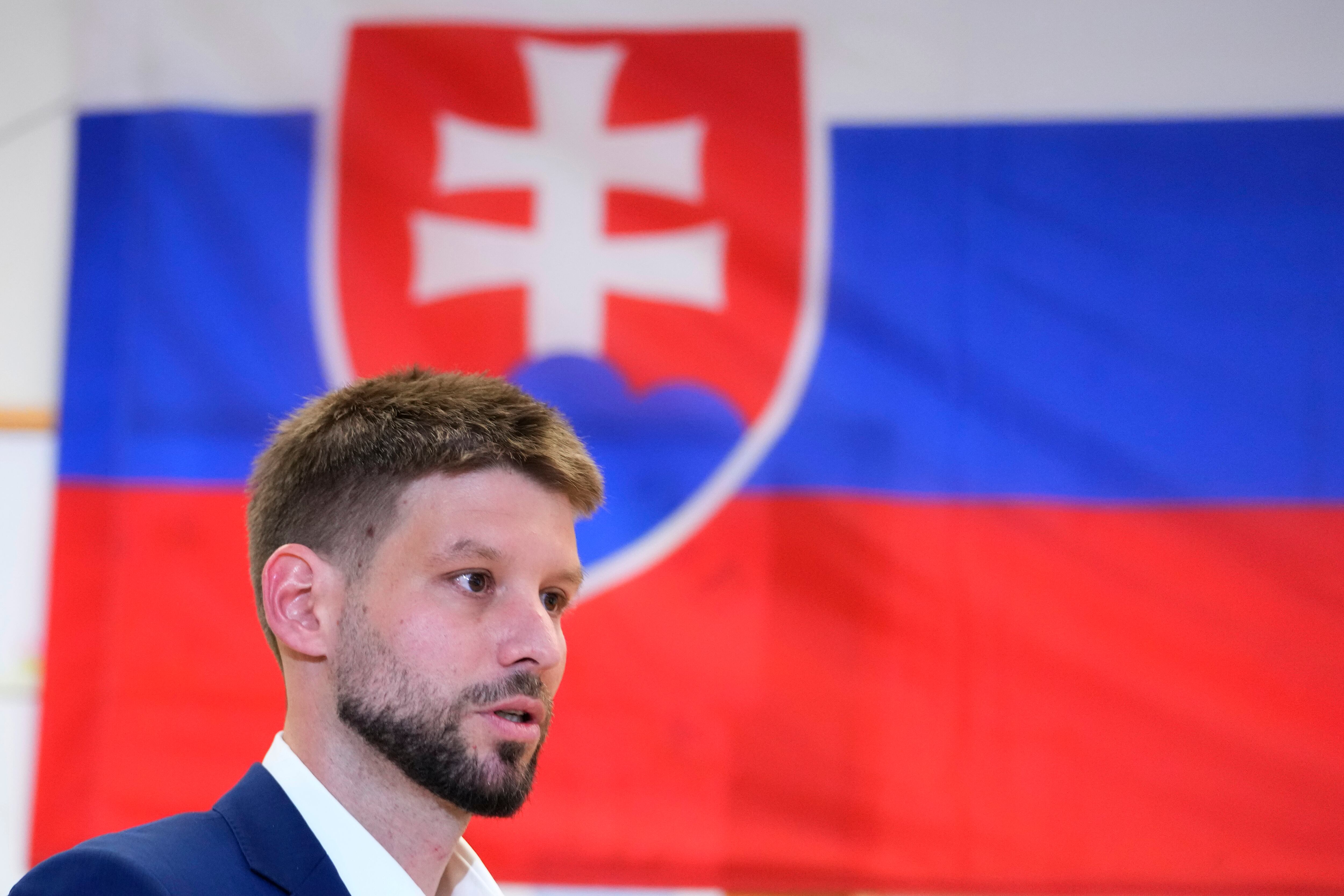 Leader of Progressive Slovakia party Michal Simecka prepares to cast his vote at a polling station during an early parliamentary election in Bratislava, Slovakia, Saturday, Sept. 30, 2023.