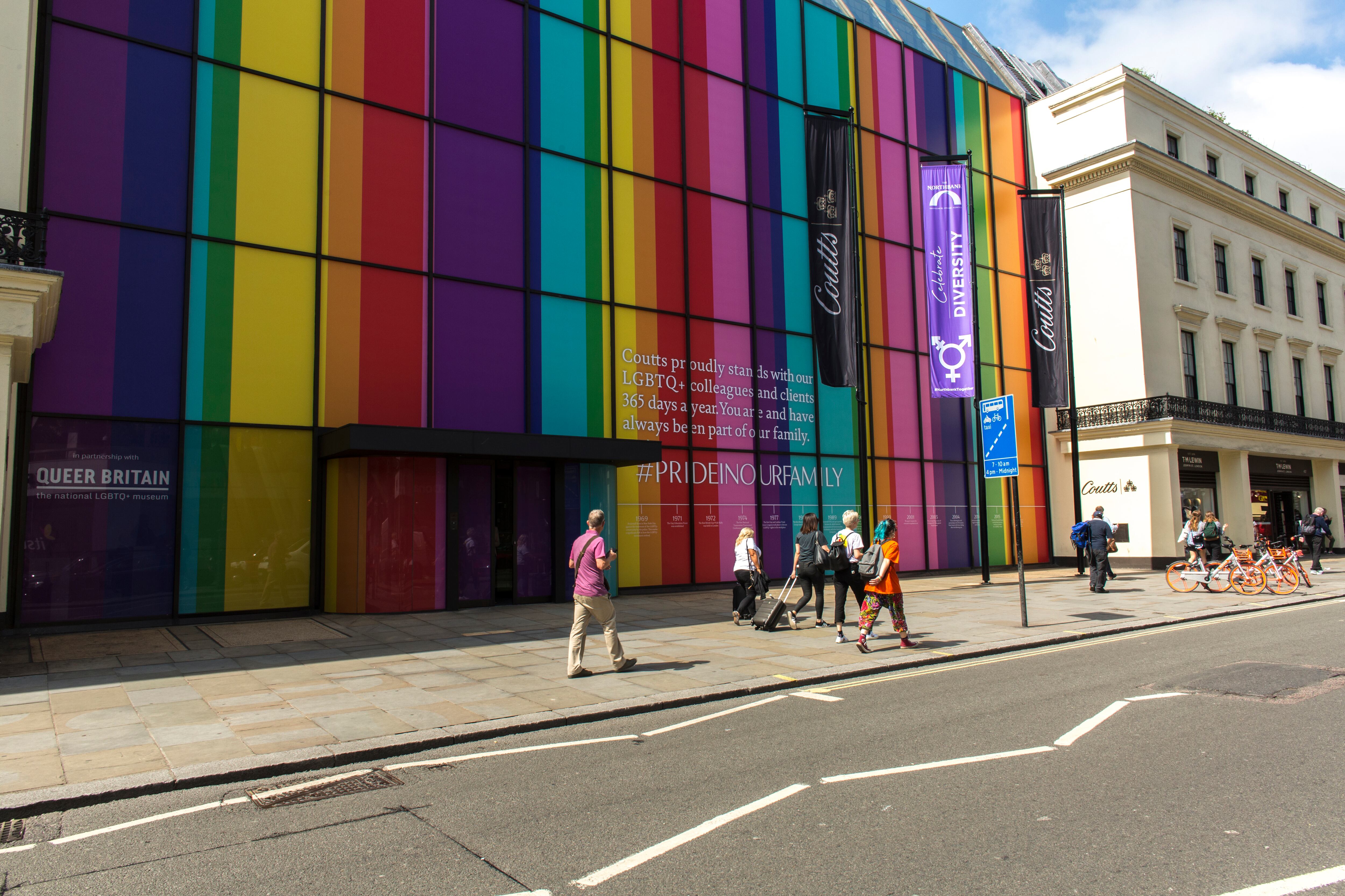 A London shopping mall with its entire facade lined with the colors of the LGBTQI+ flag in 2019.