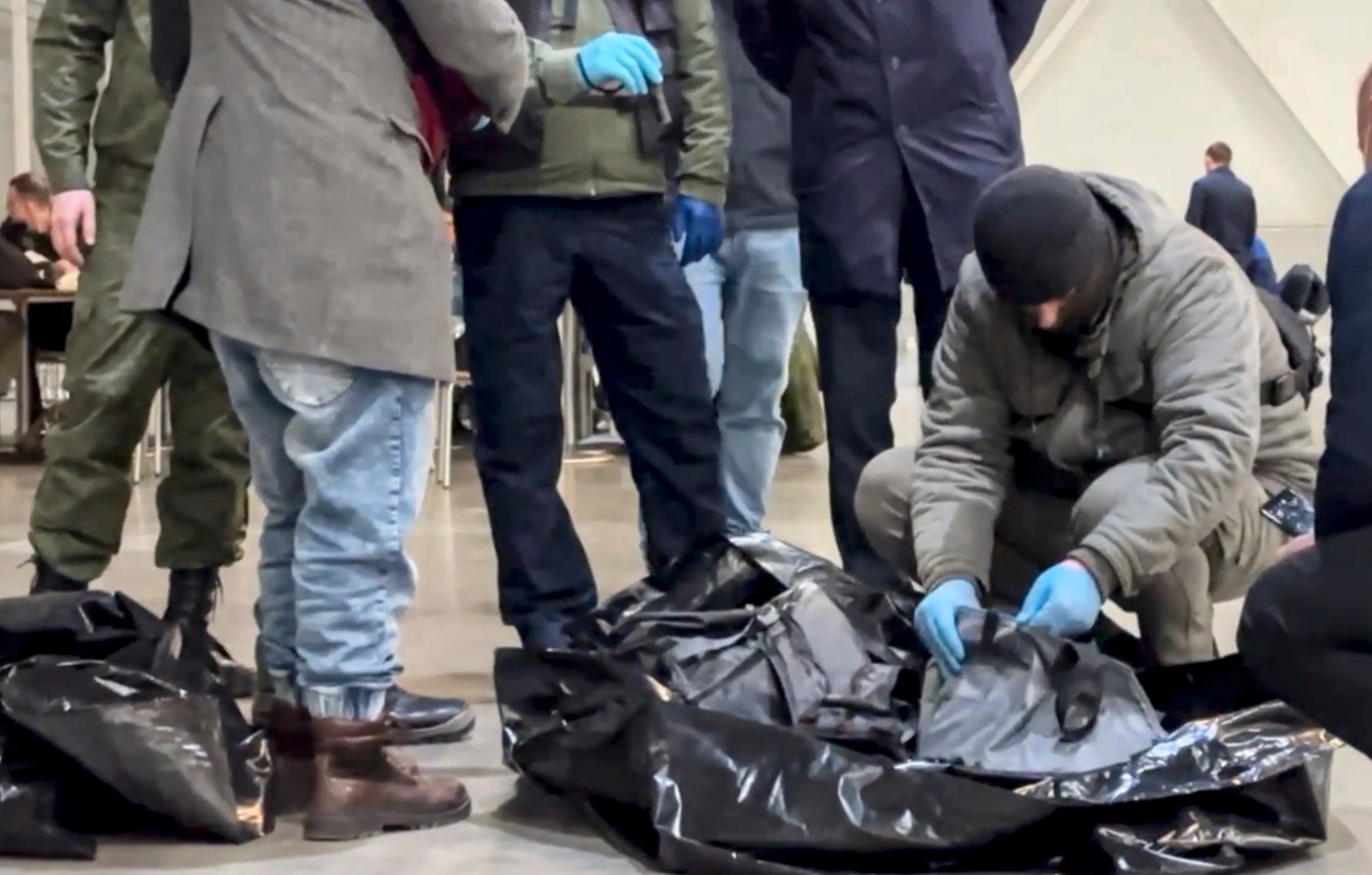 Investigators at the site of the terrorist attack on Saturday in the Moscow region.