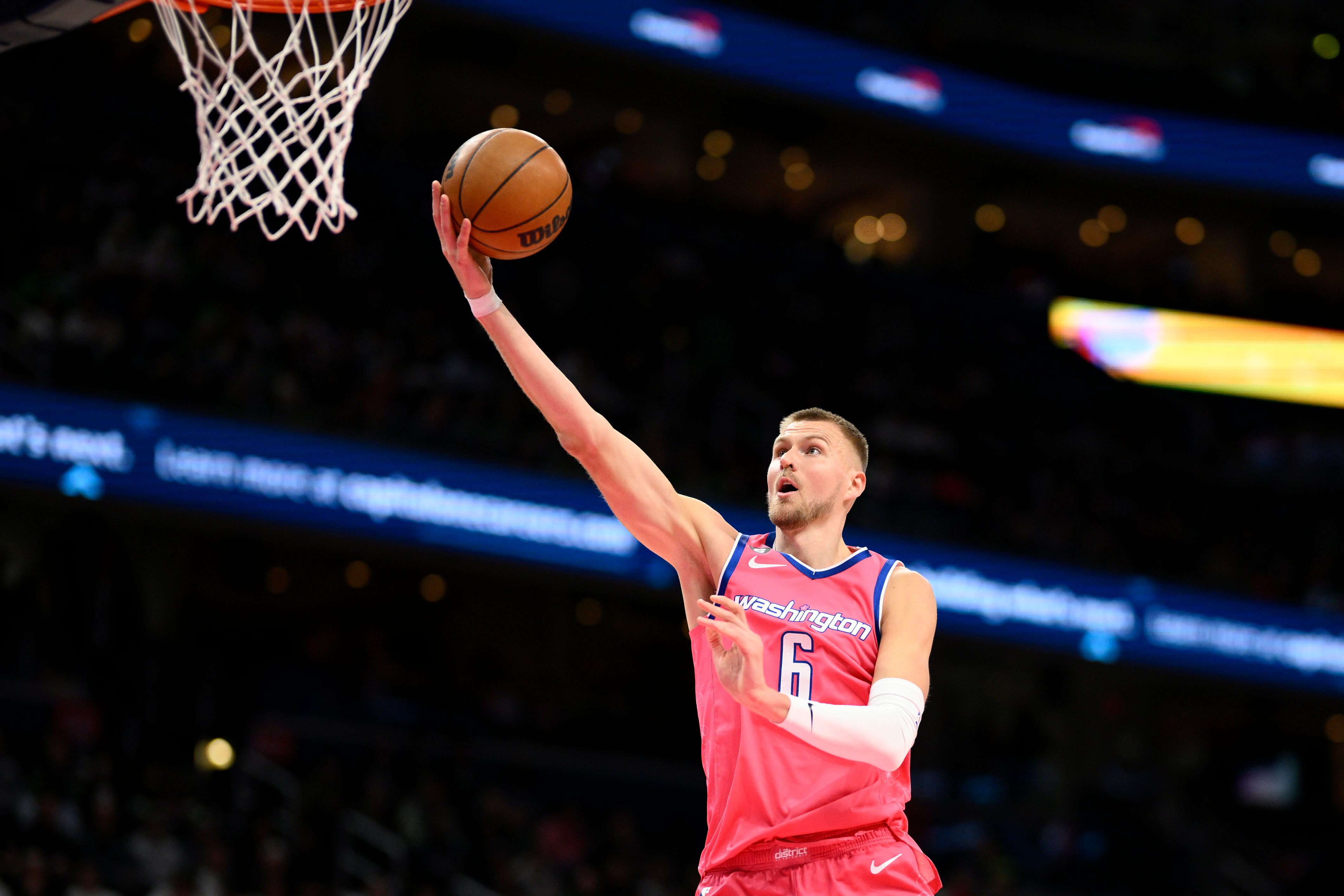 Washington Wizards center Kristaps Porzingis (6) goes to the basket during the first half of an NBA basketball game against the Boston Celtics, Tuesday, March 28, 2023, in Washington.