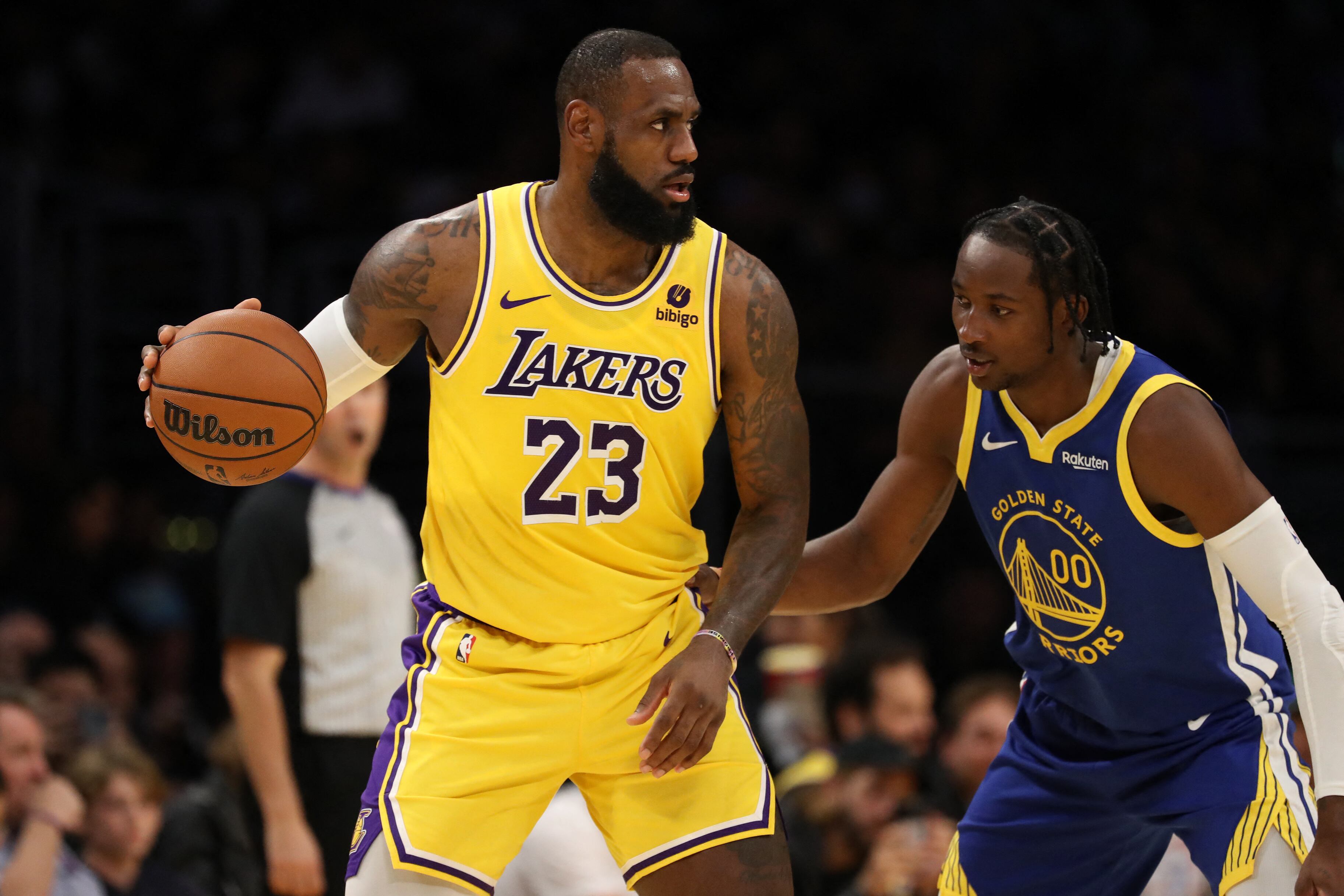 Los Angeles Lakers forward LeBron James (23) matches up against Golden State Warriors forward Jonathan Kuminga (00) during the first half at Crypto.com Arena, in Los Angeles, on Oct 12, 2023.