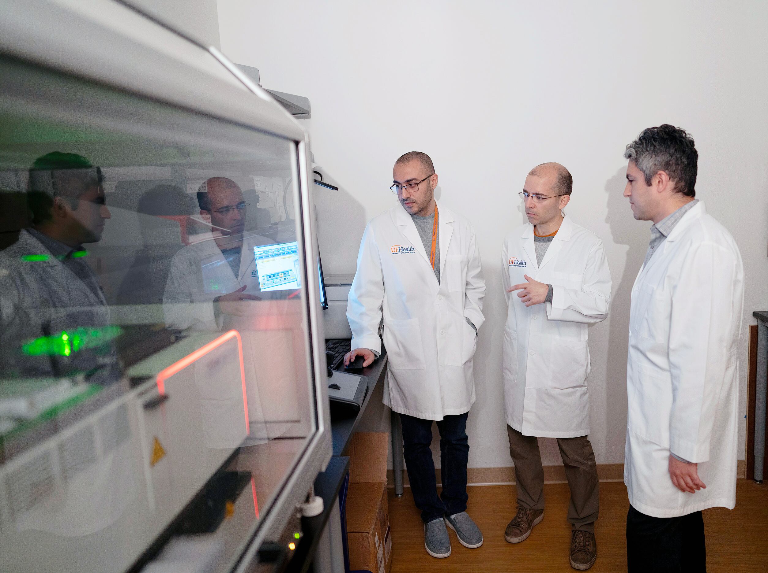 From left to right, scientists Sadeem Qdaisat, Hector Méndez and Elias Sayour, co-creators of the experimental vaccine against glioblastoma, at the University of Florida.