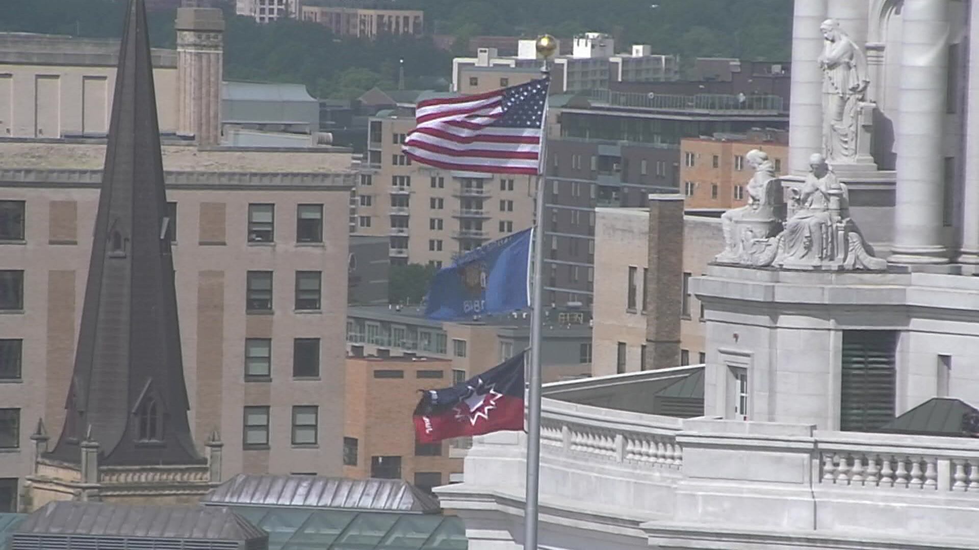 FILE- The Juneteenth flag flies over the Wisconsin state capitol, on June 18, 2021.