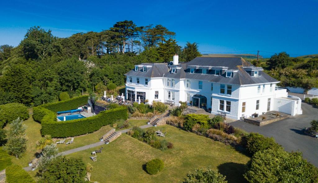 an aerial view of a large white house at The St Enodoc Hotel in Wadebridge