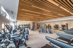 a gym with several treadmills and cardio machines at Harbour Hotel & Spa Richmond in Richmond upon Thames