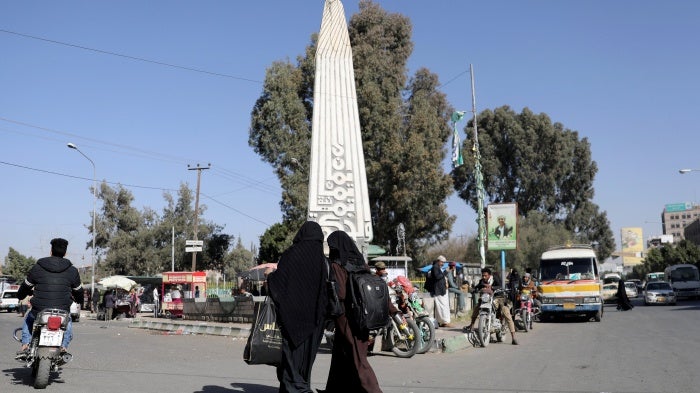 Women walk at the “Change Square” outside Sanaa University’s gate, Sanaa, Yemen. 