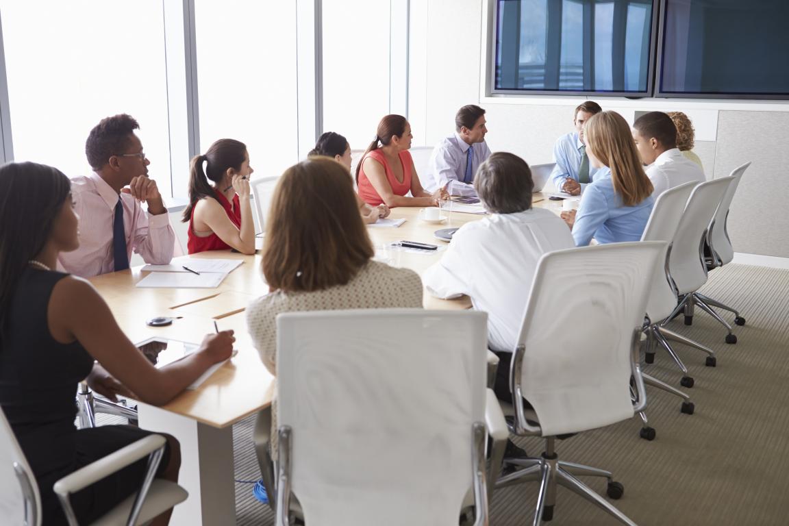 people sitting at a table during meeting
