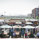 Image of people gathered at SPARK Social SF, an outdoor food truck park and gathering space