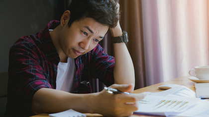 Man reviewing credit card statement