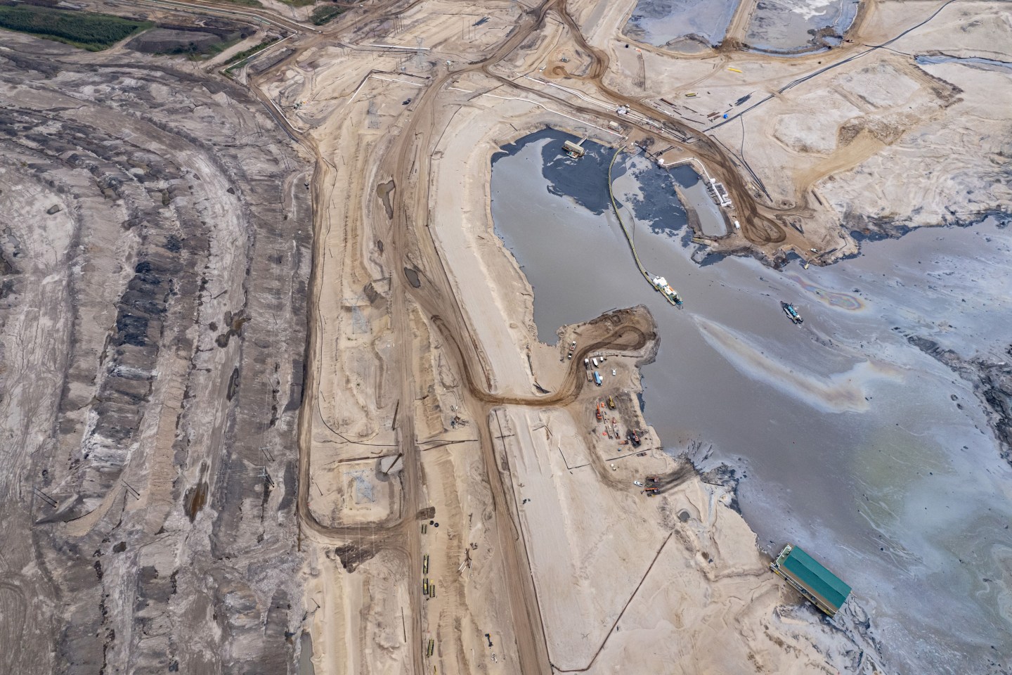 A general view shows an oil sands mining operation and facility near Fort McKay, Alberta, on September 7, 2022. &#8211; At Fort McKay near Fort McMurray in western Canada, in the heart of the country&#8217;s boreal forest, the pines and the people were long ago cleared out to make way for huge open-pit mines dedicated to excavation of oil sands. (Photo by Ed JONES / AFP) (Photo by ED JONES/AFP via Getty Images)